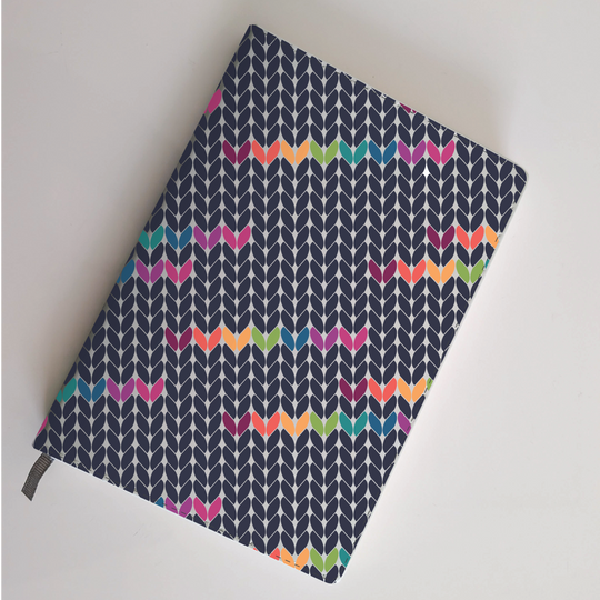 By Design: In Stitches